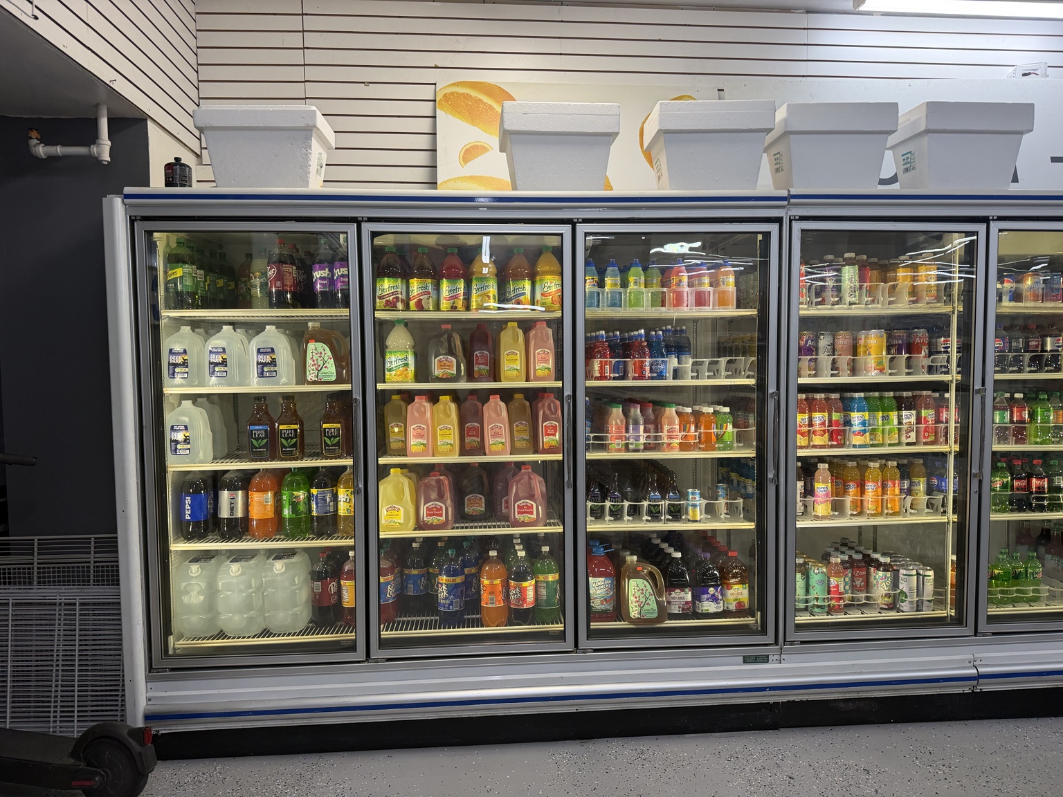 Refrigerated cases filled with drinks and milk