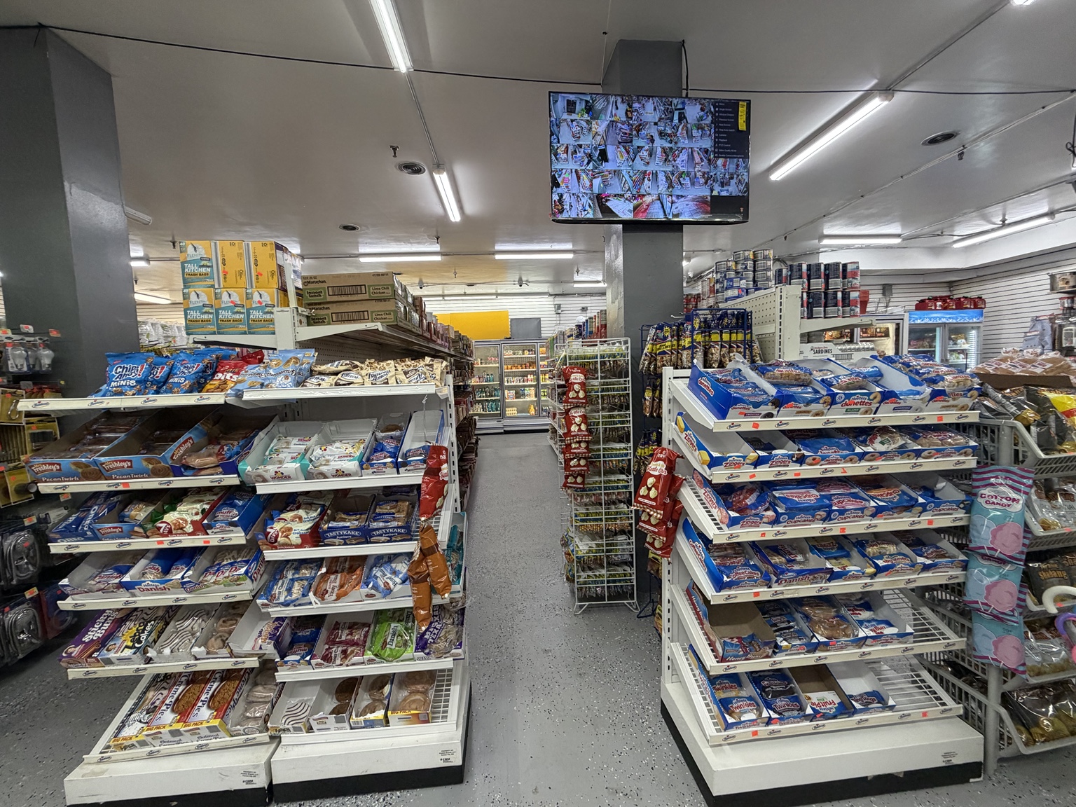 A wide view of Penn Corner Market's grocery aisles